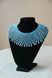 A glass bead necklace, blue with pink