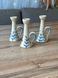 Small milk-colored candleholder with a handle