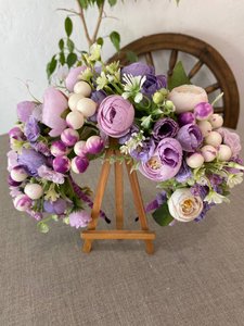 Hoop with lilac and milk flowers and berries