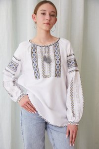Women's handmade embroidered shirt with yellow and blue elements