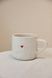 A mug with a red heart