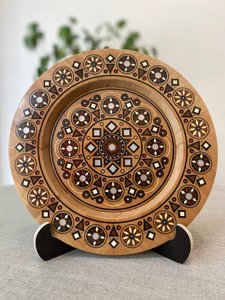 Wooden plate with inlay