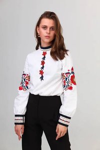Women's white embroidered blouse with flowers