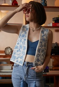 White vest with blue embroidery