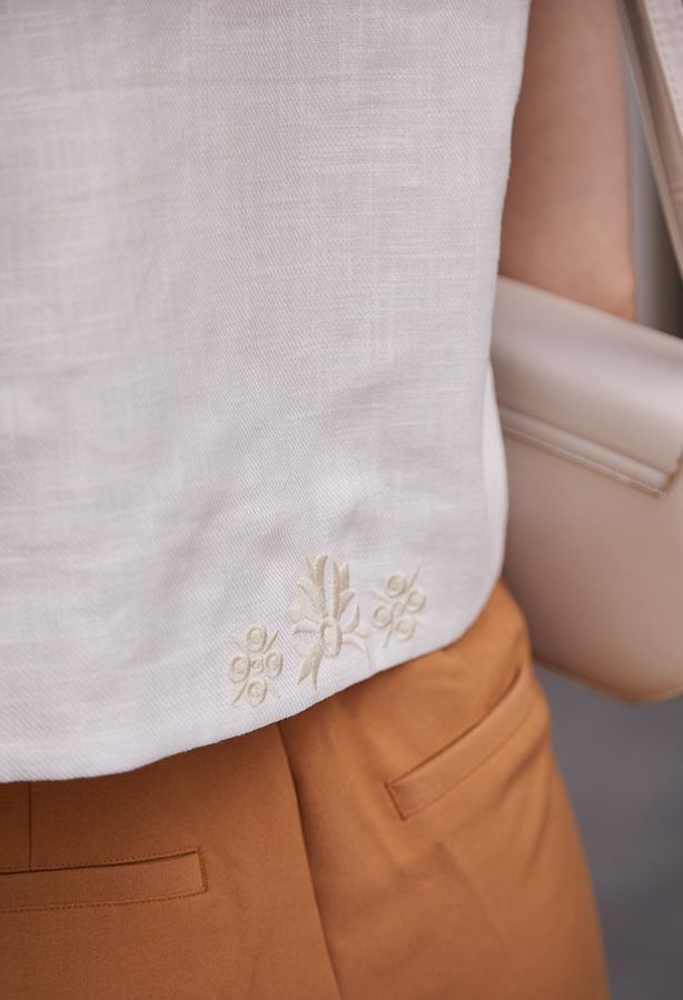 White vest with milk-colored embroidery