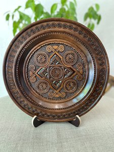 Carved wooden plate, dark