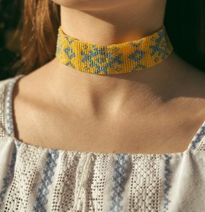 Ribbon gerdanum with yellow and blue ornament