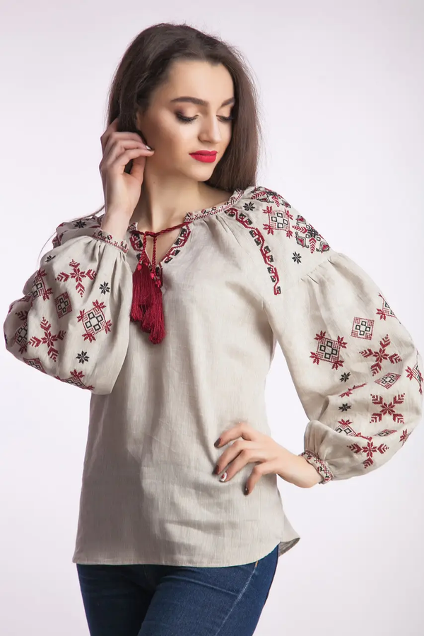 Women's beige embroidered jacket with red and black ornament
