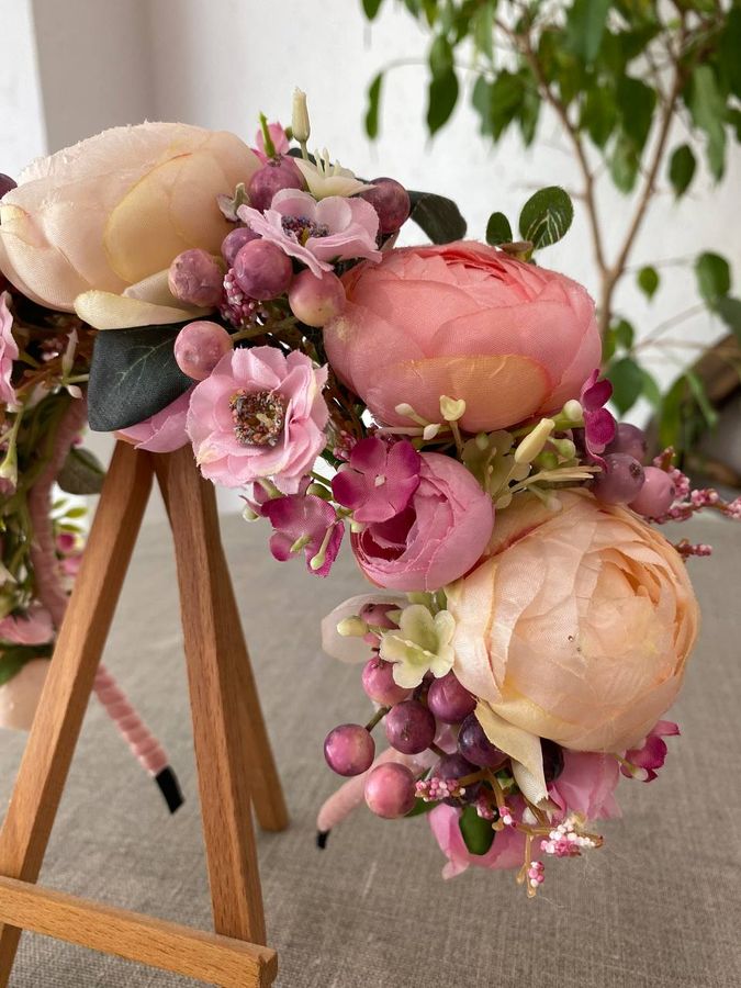 Hoop of milky pink peonies with berries